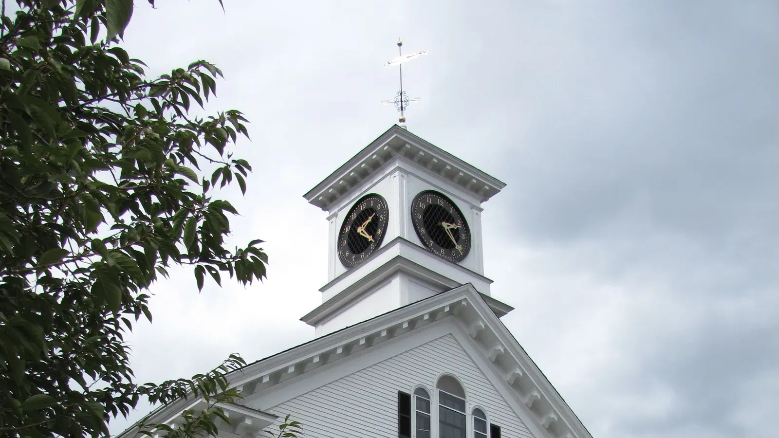 Acton Town Hall, a white Greek Revival building with a clock tower and portico, Acton, Massachusetts