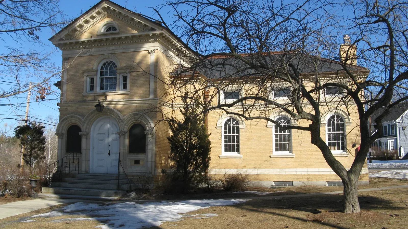 Houghton Memorial Building, a tan-brick Italianate library, Littleton, Massachusetts