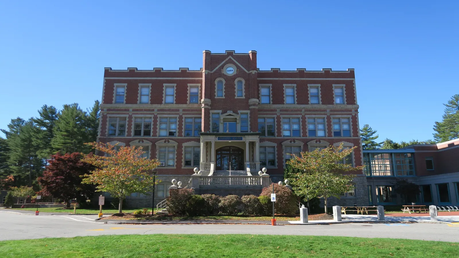 Grand brick-and-stone academy building with a crenellated central tower, Tyngsborough, Massachusetts