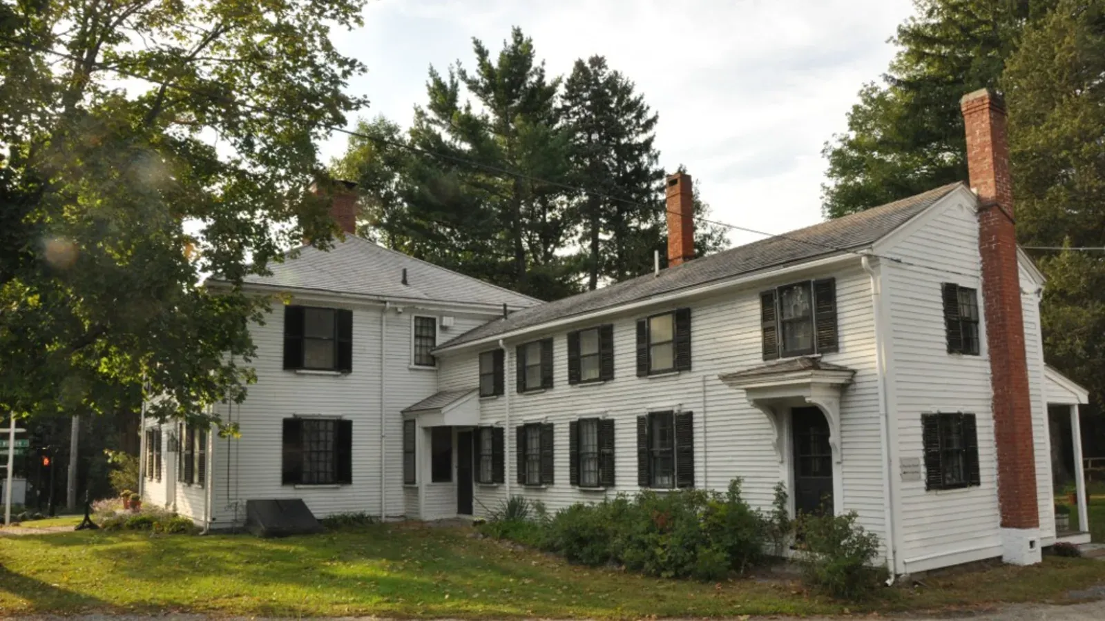 Harnden Tavern, a historic white colonial house museum with black shutters, Wilmington, Massachusetts
